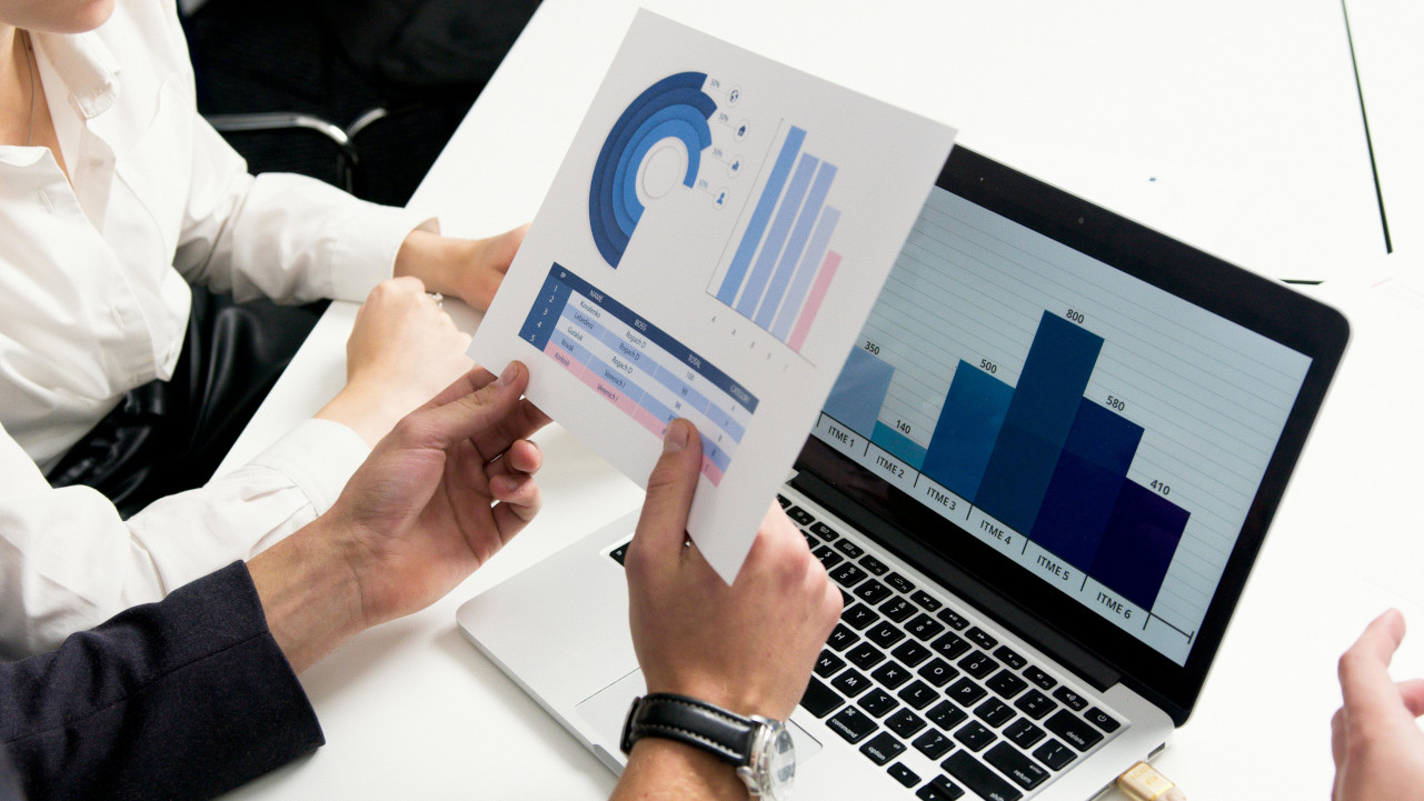 Sales team discussing charts and graphs